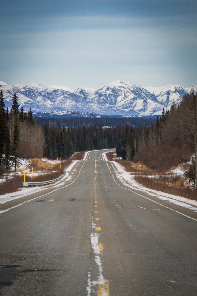 a view of the open road and mountains during a travel nursing assignment.